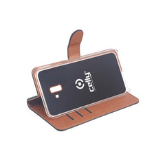 WALLY - Custodia a libro in pelle sintetica con chiusura flap magnetico, slot per carte e funzione stand colore nero compatibile con Samsung Galaxy J6+